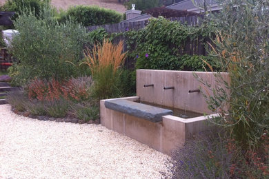 This is an example of a mid-sized backyard partial sun garden in San Francisco.