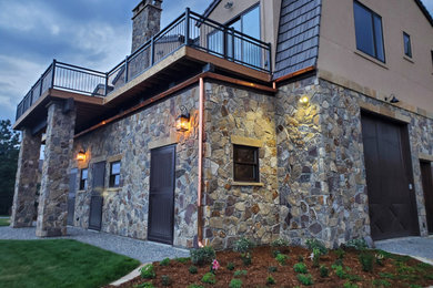 Large cottage multicolored two-story mixed siding house exterior photo in Denver