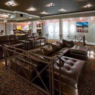 Home theater - traditional multicolored floor home theater idea in New York