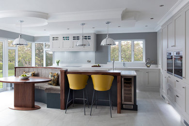 Design ideas for a transitional kitchen in Belfast with with island.