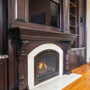 Dark Stained Cherry Cabinetry Surrounds Flush Hearth Stone Tile Fireplace