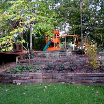 Alexandria Sloped Yard - Raised Patio, Fire Pit, & Water Feature