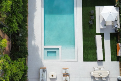 Inspiration for a large mediterranean backyard rectangular lap pool remodel in Los Angeles with decking