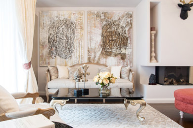 Living room - large eclectic open concept dark wood floor and brown floor living room idea in Other with beige walls, a standard fireplace and a wall-mounted tv