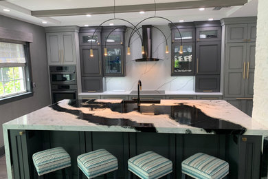 Eat-in kitchen - large modern galley vinyl floor, gray floor and exposed beam eat-in kitchen idea in Miami with a farmhouse sink, shaker cabinets, gray cabinets, quartzite countertops, white backsplash, stainless steel appliances, an island and black countertops