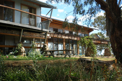 Inspiration for a mid-sized country one-storey exterior in Newcastle - Maitland with metal siding.