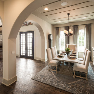 Design ideas for a mediterranean open plan dining in Austin with white walls, dark hardwood floors and brown floor.