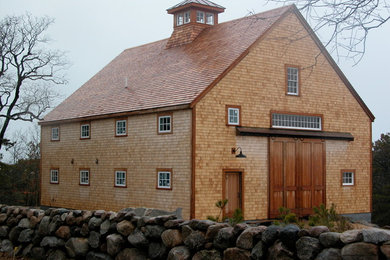 Mid-sized mountain style brown three-story brick gable roof photo in Burlington