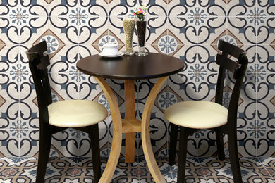 Example of a small trendy porcelain tile and brown floor kitchen/dining room combo design in San Francisco with beige walls and no fireplace