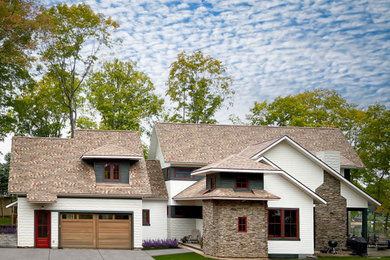 Mid-sized danish white two-story mixed siding and shingle exterior home photo in Minneapolis with a shingle roof and a brown roof