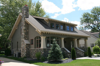 Modelo de fachada de casa gris y gris de dos plantas