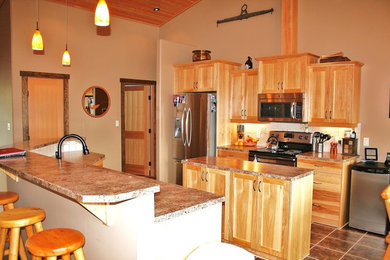 Inspiration for a mid-sized rustic galley ceramic tile eat-in kitchen remodel in Vancouver with an undermount sink, shaker cabinets, light wood cabinets, granite countertops, white backsplash, ceramic backsplash, stainless steel appliances and an island