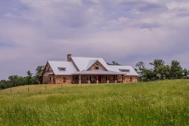 Example of a farmhouse exterior home design in Houston
