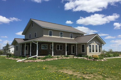 Example of a mid-sized transitional beige two-story concrete fiberboard gable roof design in Other