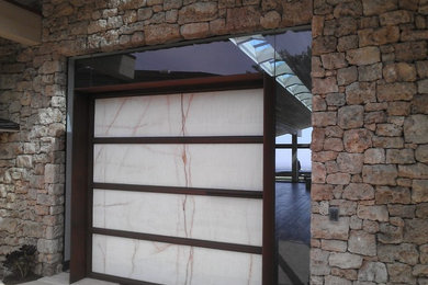 Inspiration for a small modern attached one-car garage workshop remodel in Los Angeles