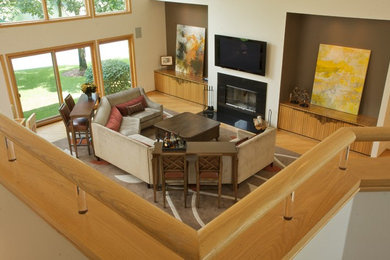Inspiration for a transitional open concept living room remodel in Chicago with a standard fireplace and a stone fireplace