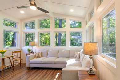 Inspiration for a 1960s light wood floor and brown floor sunroom remodel in Detroit