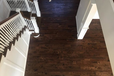 Example of a mid-sized classic wooden l-shaped wood railing staircase design in Other with painted risers