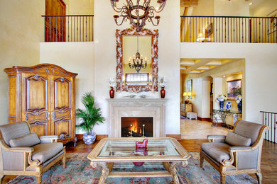 Example of a mid-sized classic formal and open concept medium tone wood floor living room design in Seattle with beige walls, a standard fireplace, a stone fireplace and no tv