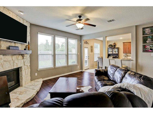 Decorate odd-shape living room with corner fireplace