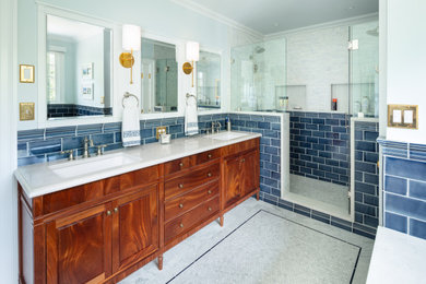 Bathroom - traditional master blue tile and subway tile marble floor, multicolored floor, double-sink and wainscoting bathroom idea in Boston with furniture-like cabinets, dark wood cabinets, an undermount tub, a bidet, blue walls, an undermount sink, quartz countertops, a hinged shower door, white countertops and a built-in vanity