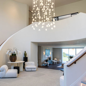 Statement Glass Lighting in a Double-Height Entryway