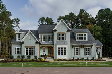 Example of a two-story exterior home design in Raleigh