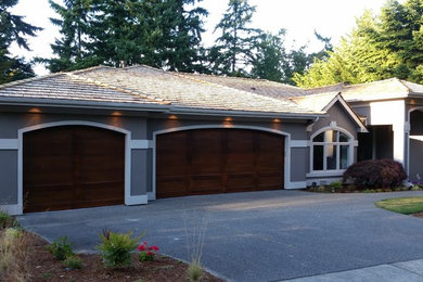 Mid-sized trendy gray two-story stucco exterior home photo in Seattle