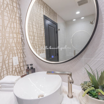 Contemporary Primary and Hall Bath Remodels with Hotel-Inspired Design