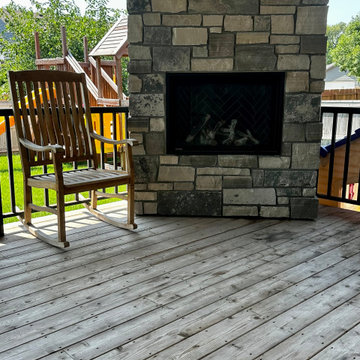 Custom Cedar Covered Deck with Built-In Stone Fireplace and Patio — Sioux Falls