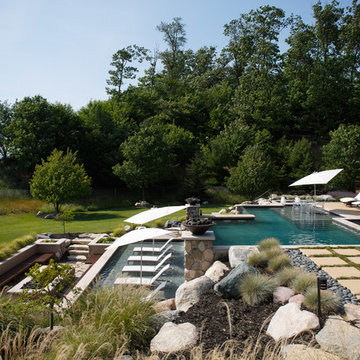 Modern pool, spa and landscape on lakeshore