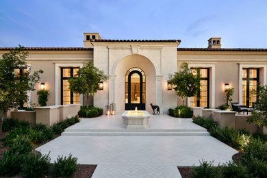 Example of a tuscan home design design in Phoenix