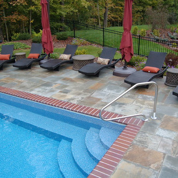 Bluestone pool decks, arbors, fireplaces, outdoor kitchen & pavilion
