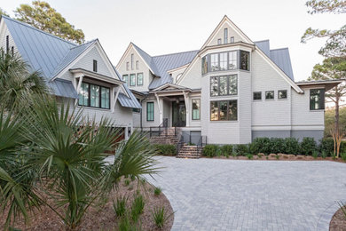 This is an example of a beach style home design in Charleston.