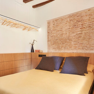 dormitorio con cabecero esquinero