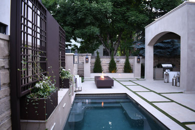 Photo of a large modern privacy and full sun backyard landscaping in Denver for summer.