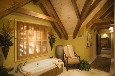 Drop-in bathtub - large craftsman master beige tile and ceramic tile ceramic tile drop-in bathtub idea in Charlotte with furniture-like cabinets, dark wood cabinets and yellow walls