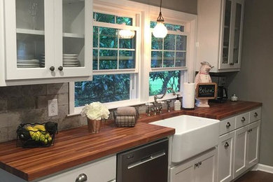Eclectic light wood floor and brown floor kitchen photo in Other with a farmhouse sink, wood countertops, porcelain backsplash and stainless steel appliances
