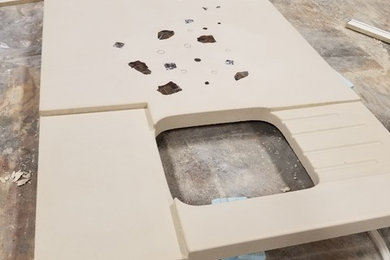 Concrete countertop with lighted colored glass inlay