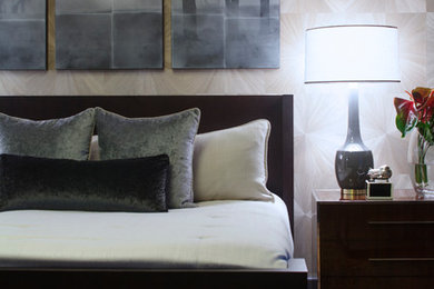 Large trendy master medium tone wood floor bedroom photo in Atlanta with beige walls