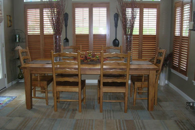 Example of a large mountain style carpeted kitchen/dining room combo design in Cleveland with gray walls and no fireplace