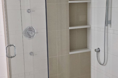 Example of a large trendy master porcelain tile and beige floor bathroom design in Other with white walls and a hinged shower door