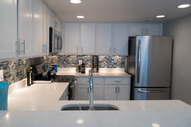 Example of a beach style kitchen design in Other