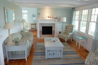 Inspiration for a mid-sized coastal open concept living room remodel in Boston with green walls and a standard fireplace