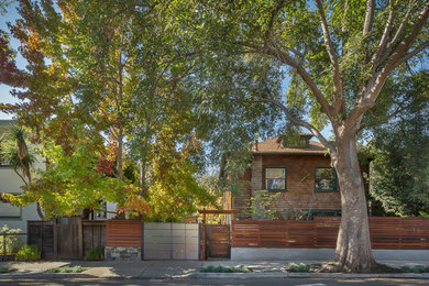 This is an example of a mid-sized modern partial sun front yard concrete paver retaining wall landscape in San Francisco for fall.