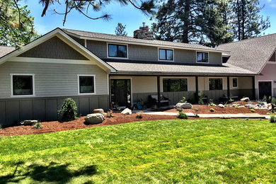 Large transitional gray two-story wood exterior home photo in Other with a shingle roof