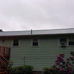 Metal Roof on Split-level Home - Roofing And Gutters