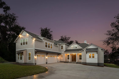Inspiration for a large coastal gray two-story concrete fiberboard gable roof remodel in Jacksonville