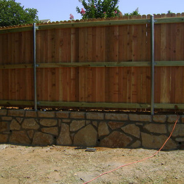 Cedar Fence on Stone Retaining Wall