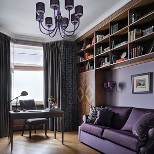 Inspiration for a traditional study room in Moscow with purple walls, medium hardwood floors and a freestanding desk.